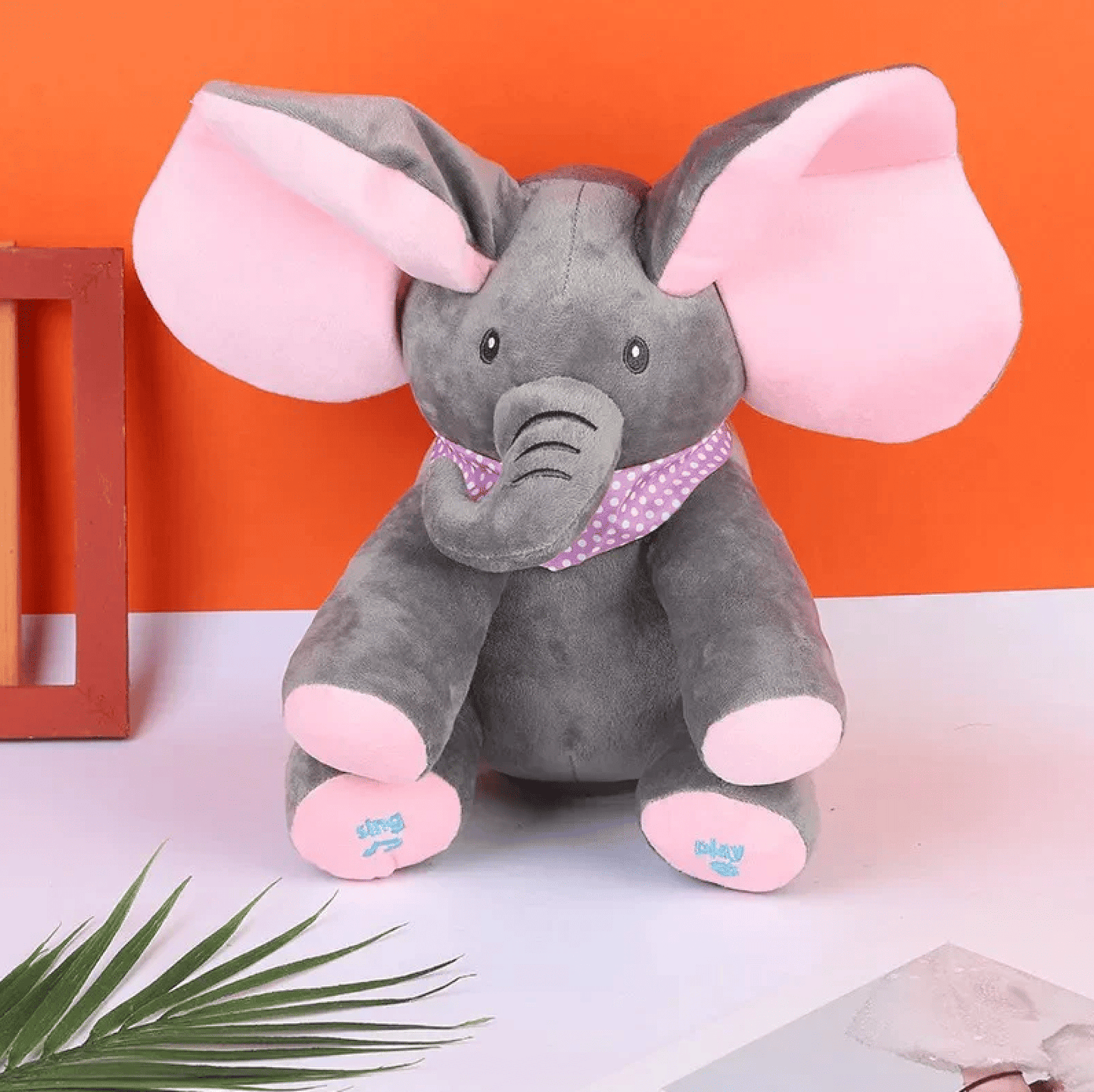 Peek-a-Boo Buddy™ elephant with floppy ears and musical features