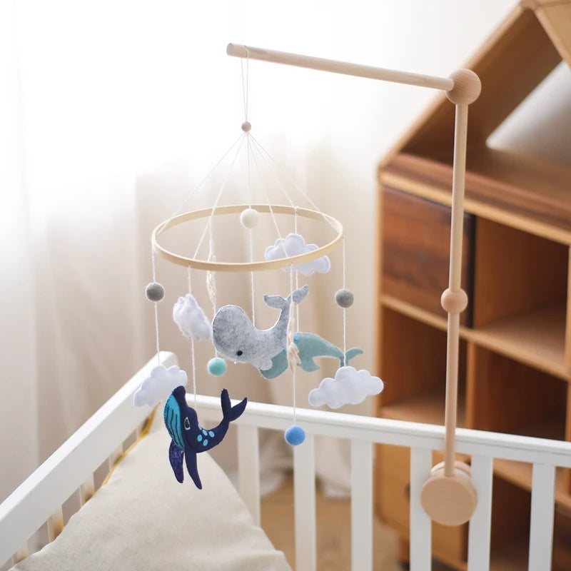 Pastel baby mobile with crochet whale and wooden frame
