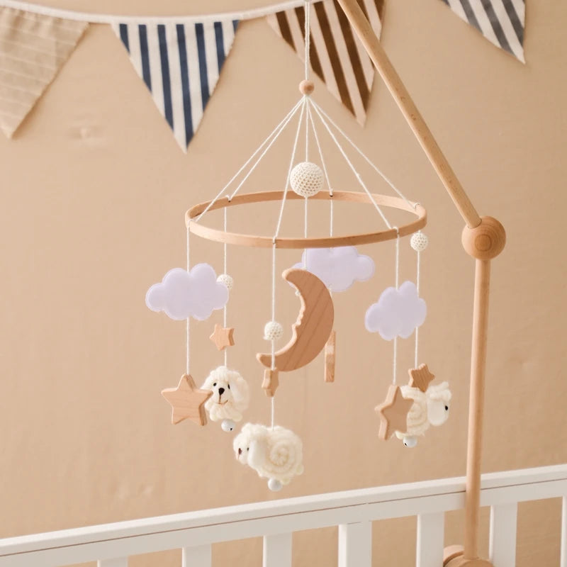 Wooden crib mobile with soft toys