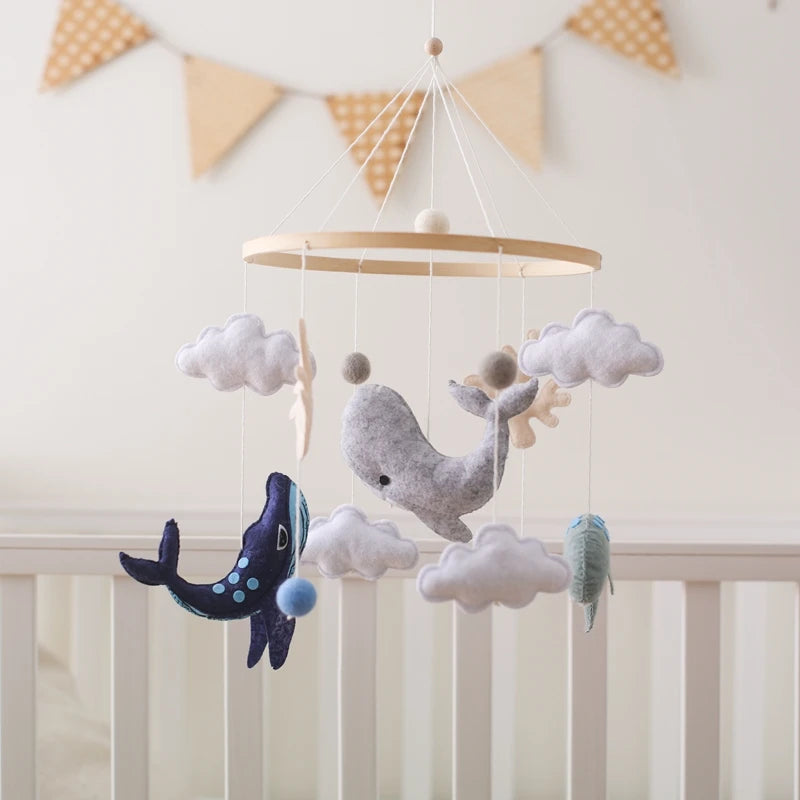 Decorative whale crib mobile with clouds and stars