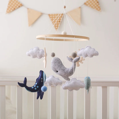 Decorative whale crib mobile with clouds and stars