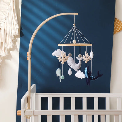 Baby mobile with whale, clouds, and stars – natural wood frame